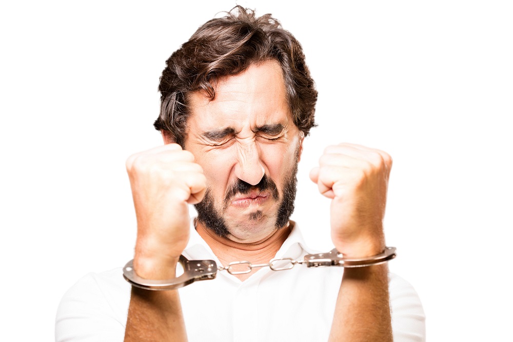 young cool man with handcuffs